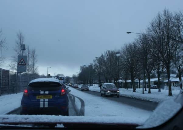 The scene on Northland Road on Tuesday as road conditions worsened after heavy snowfall. DER0215MC011