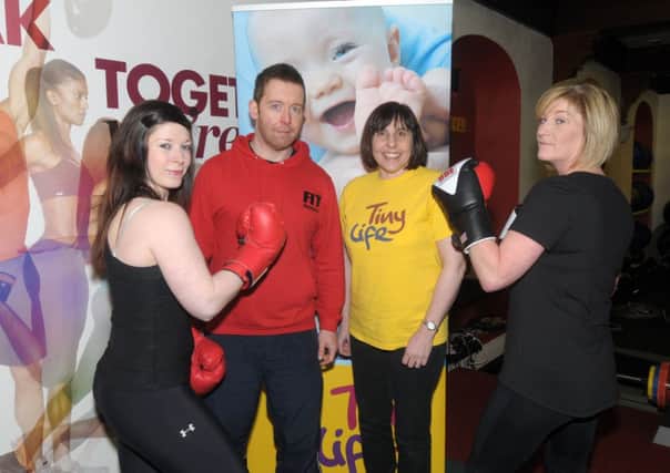 Larne's Fit Factory's Phil Barnhill, Naomi Gale and Donna Masterson who will be taking part in a White Collar Boxing Tournament later in the year with Tiny Life's Charity Fundraiser, Gillian Breen INLT 03-200-AM