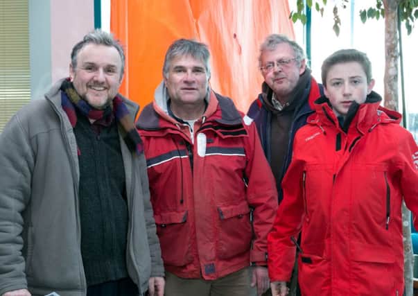 Jonny Gruhn, Jeremy Bryce and Cameron Date join with Iain McAllister (2nd from left) from Belfast Lough Sailability during the open day held in the Marina building. INCT 03-401-RM