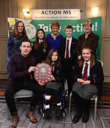 Pictured at the Walk for MS 2014 awards luncheon are Vivienne Ross and Sharon Shannon from Carrickfergus Grammar School, pupils William Gordon, Bethany McQuiston, Sian Reid and Emma Nesbitt and Ann Walker MBE, CEO, Action MS and Connor Phillips, Cool FM and Action Ms youth patron. INCT 03-750-CON