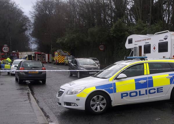 Emergency services at the scene between Governors Road and Ravarnet Road in Lisburn where it is believed that strong winds brought a tree down on top of a work mans van