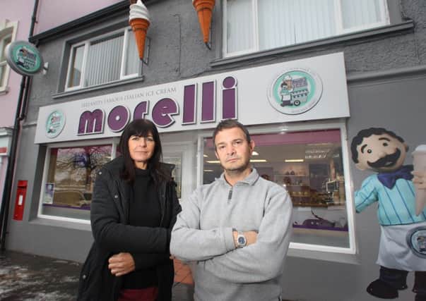 Romeo and Deidre outside their ice cream parlour in Ballycastle where Planning Service are forcing them to take down their illuminated sign by start of February or face heafty fines of £2500 and £250 per day after a given date...PICTURE STEVEN MCAULEY/MCAULEY MULTIMEDIA