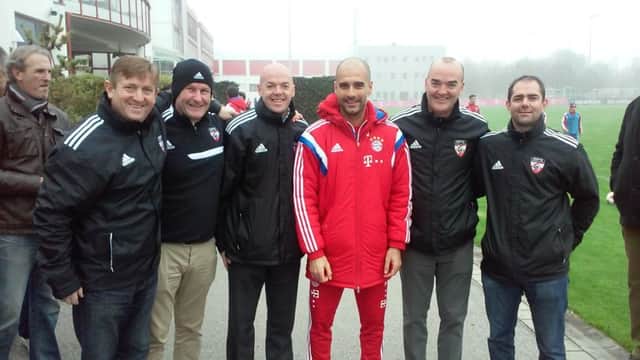 Bayern Munich manager Pep Guardiola pictured alongside Global Premier Soccer officials from left to right Paul Baber (General Manager GPS - Maine); Phillip Mitchell (International Director); Joe Bradley (CEO GPS); Peter Bradley, (Director of Coaching) and Neil Holloway (General Manager GPS - New Jersey).