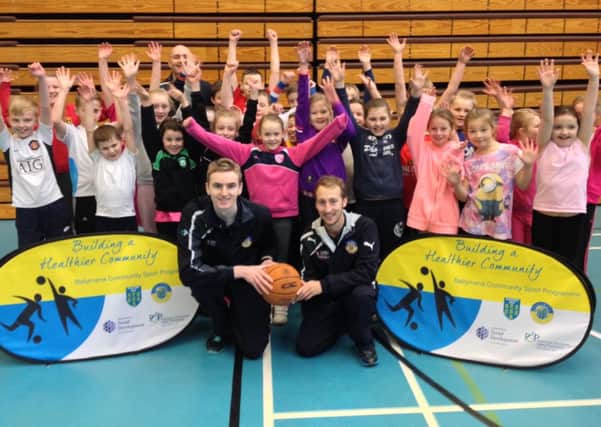 Pupils from Ballykeel PS and St Brigid's PS who took part in the recent Basketball Twinning Programme.
