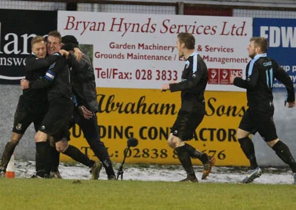 Ballymena United's players mob Allan jenkins after his late equaliser at Shamrock Park. Picture: Pacemaker Press