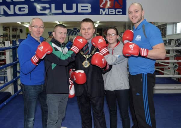 Paul Johnston (left) and Jade Adams from Monkstown Boxing Club with Olympic boxer Paddy Barnes, Newtownabbey Mayor Thomas Hogg and world champion kickboxer Daniel Quigley (right). INNT 04-201-AM