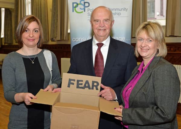 "Put fear of crime in the box" was the theme of the PSNI and Police Community Safety Partnership initiative launched in Larne Town Hall pictured are (from left) Gemma Mateer PSNI Crime Prevention Officer, PCSP Chair, Michael Lynch and PCSP Manager, Wendy Carson. INLT 04-023-PSB