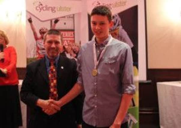 Foyle Cycling Clubs Ryan Reilly, from Ardmore, receives his Ulster Road Race Junior Champion 2014 medal at the Ulster Cycling awards night.