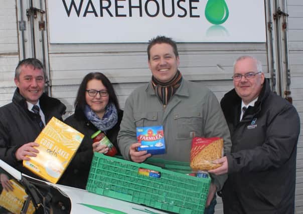 Pictured at Causeway Foodbank at The Vinyard in conjunction with Roadside Garage are Ian Lamont, Steven McConaghy, Pastor Ricky Wright, and Melanie Gibson.