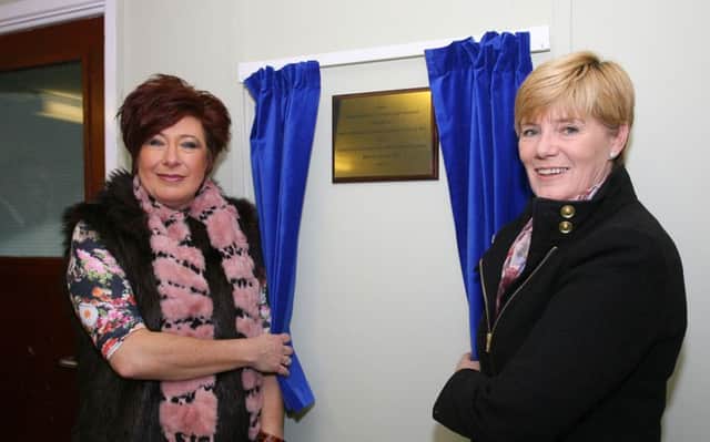 Sheila McClelland (left), chief executive of Carrickfergus Borough Council, and Chris Davis, Good Relations officer with the Housing Executive, officially open the community facility in Castlemara at the weekend. INCT 04-752-CON