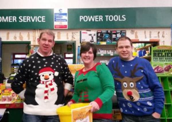 Pictured are staff from the Carrick branch of JP Corry: Craig Paterson, counter sales; Patricia McCully, branch manager, and Stephen Annette, counter and telesales.  INCT 02-725-CON