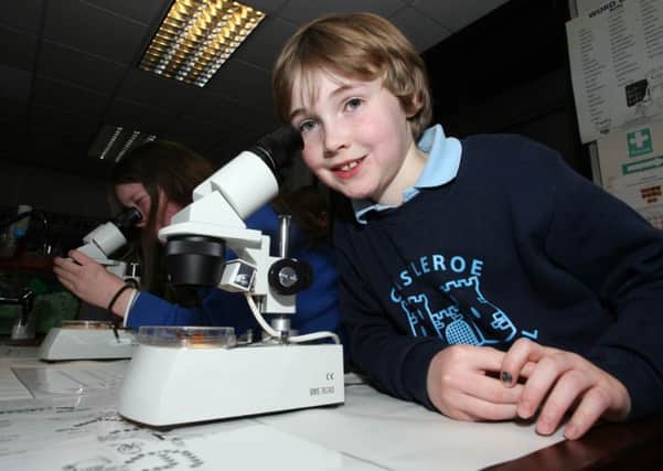 Ryan Strong with a science microscope during the Dominican College Open Night last Wednesday. INCR3-322PL