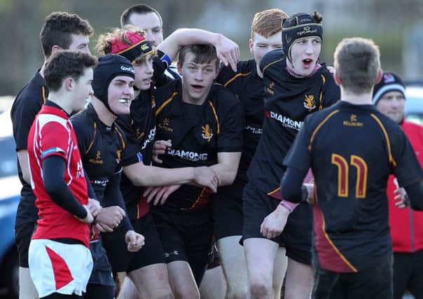 Foyle College's Robbie House celebrates scoring a try against Regent House during Saturday morning's Danske Bank Schools' Cup tie at Newtownards. Picture by Brian Little/Presseye