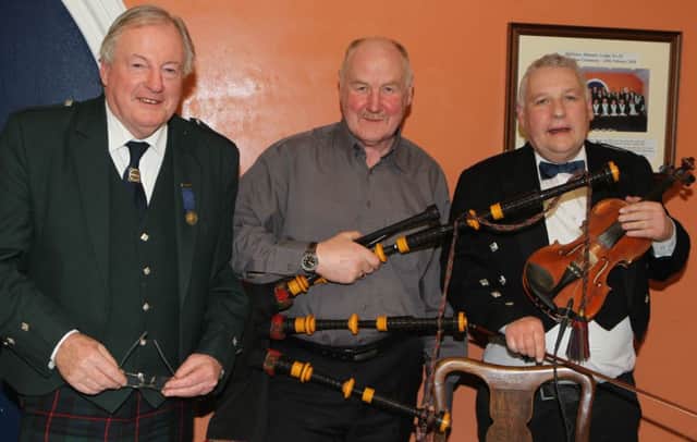 Jim Fairbairn Master of Cermonies Dan McElreavy Pipes and Micheal Kennedy who provided the etertainment for the Burns supper dance held in Ballintoy Masonic Hall and organised by Ballintoy Lodge 38