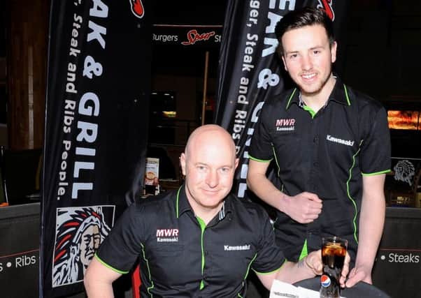 Carrick rider Andrew Irwin with MWR Kawasaki team boss Mark Webster at Spur Steak and Grill, sponsor of the Hillsborough-based team.