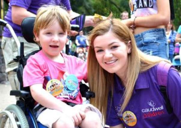 Niamh on the trip last year with one of the children