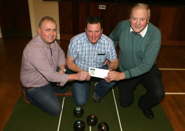 Tommy Hamill of William Hamill and Sons, and Robert Black present sponsorship cheque to Alastair McCullough (tournament organiser) for the the forthcoming annual Buckna Indoor Bowls tournament. The club would like to thank all those who are supporting and sponsoring this competition, including James McNeill Grocers and Harware, Broughshane; Ricky O'Melvenna, McAllister's Butchers, Broughshane; and Omya, Glenarm. INBT05-201AC