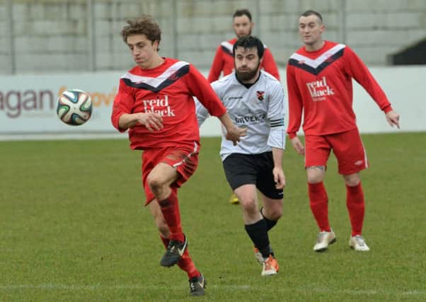 Joel Cooper in action for Ballyclare Comrades in their Intermediate Cup game against Queens University at Dixon Park. INNT 05-003-PSB