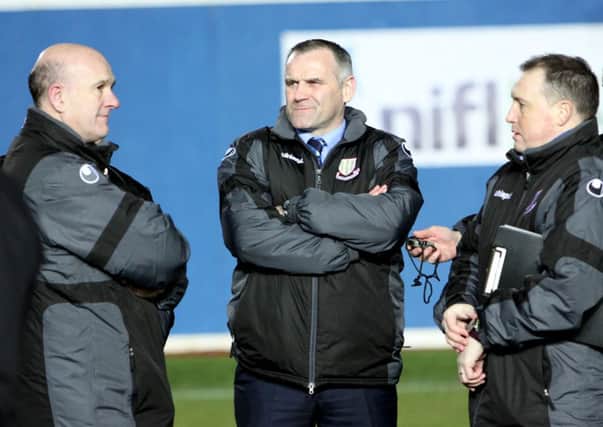 Ballymena United manager Glen Ferguson chats with Gordon McCartney and Davy Douglas after their teams defeat in the League Cup final. INBT05-264AC