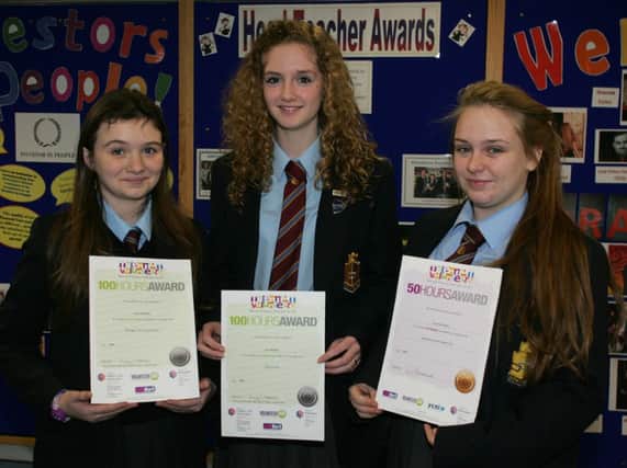 Downshire School pupils Annie Widlake, Lucy Rodgers and Courtney Clarke display their Millennium Volunteer Awards. INCT 03-708-CON