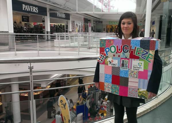 Keeva Armstong marketing the Poucheze stand at the Young Enterprise event at Foyleside.