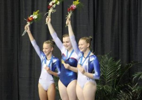 World Age Group Tumbling Champion Megan Kealy (centre). INLT-06-700-con