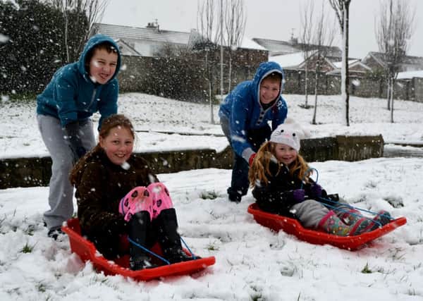 Jessica, Sophie and Jason Miscandlon with Jordan McMillan having fun in the snow. INCT 06-114-GR