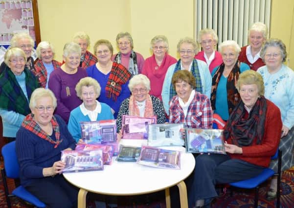The Women's Circle of First Larne Presbyterian Church with the scholar packs which they are sending to Tanzanian schoolchildren. INLT-06-706-con