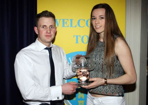 Andrew Barr of Flamingo Fitness presents Roseanna McGuckian with the Junior Sportsperson award. INBT06-221AC