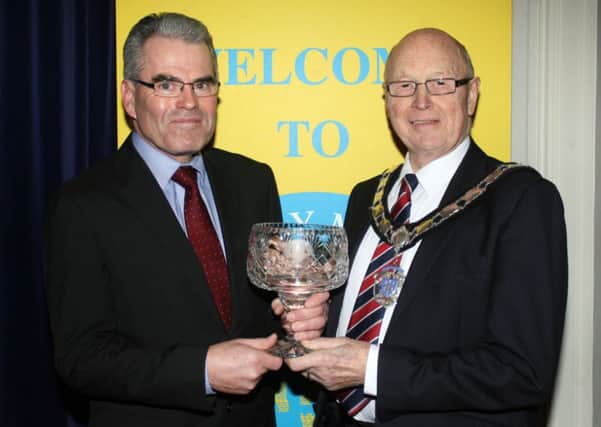 Deputy Mayor of Ballymena, Cllr. Hubert Nicholl, presents the Services of Sport to Richard Wilson. INBT06-229AC
