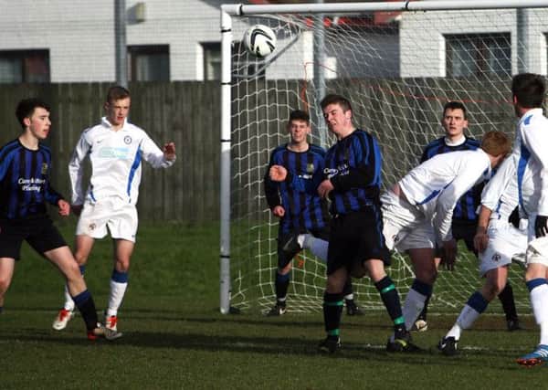 Goal mouth action between Carniny Rangers and Glenravel. INBT06-244AC