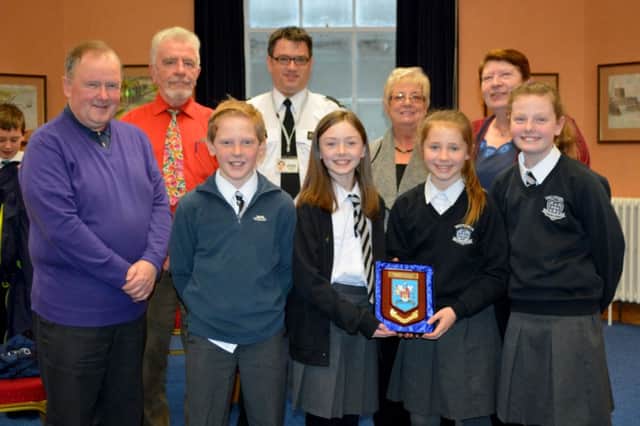Carrickfergus Road Safety Committee members with the winners of the annual quiz, Harry Norton, Bethany Preshur, Eve Thompson and Abby Redmond, Victoria Primary School. INCT 06-131-GR