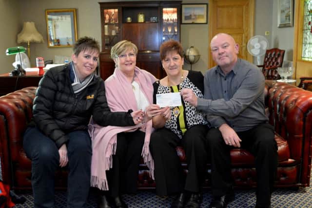 The Mayoress of Carrickfergus Patricia Johnston presents a cheque for £1750 from the Mayor's Charity fund to Ashley Hunter and Diane Strain from Carrickfergus Action Cancer Group, included is Richard Hollran from Carrick Council. INCT 06-144-GR