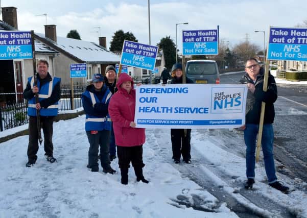 Braving the winter weather: Protestors at the NHS Not For Sale demonstration in Ballyhenry on Thursday, January 29. INNT 06-145-GR