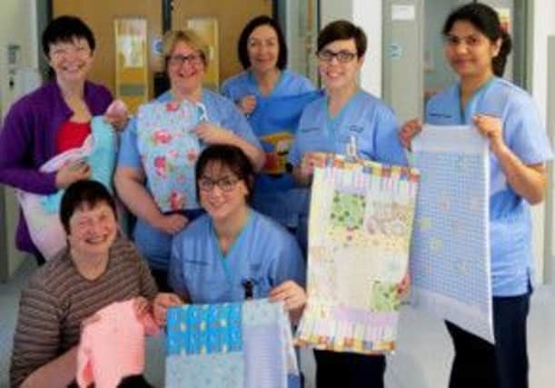 Bernie McCreanor (back left) and Linda Thompson (front left) from Carrickfergus Garden Society present knitted and crocheted items to Antrim Area Hospital's Neonatal Unit, inlcuded are hospital staff Lorraine McClenaghan, Coleen McGarry, Susie Forbes, Ann Matthews and Leanne Richmond.  INCT 06-730-CON