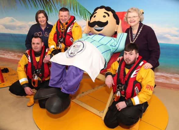 Mr. Morelli (sponsor), Councillor Yvonne Boyle, Deputy Mayor of Coleraine, Pat Storey, secretary of the fundraising and raft race committee, and Portrush Lifeboat crew members Tim Nelson, Chris Dobbin and Jason Chambers pictured launching the 2015 RNLI Raft Race in Portrush. INCR5-365PL