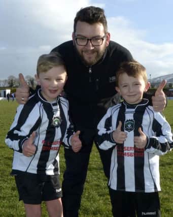 Dromara FC mascots Dean Biggerstaff and Rhys Hanna pictured with first team Manager Gerard McMahon  ©Edward Byrne Photography INBL1505-236EB