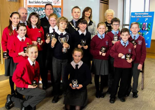 Councillor Jim Bingham, Constable Brian Herron, Mayor Thomas Hogg, Nichola Pearse of Cornmarket Insurance Services, sponsors of the Adelaide Cup, and Pat Martin, chair of Newtownabbey Road Safety Commitee with the winning quiz teams from Fairview Primary, The Thompson Primary and Ballyclare Primary. INNT 6-500-SO