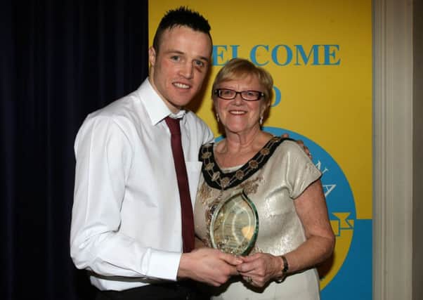 Steven Donnelly received an award from the Mayor of Ballymena, Cllr. Audrey Wales at last week's Ballymena Sports Awards, marking his participation in the Commonwealth Games. INBT06-231AC