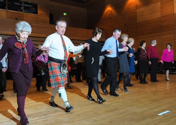 Dance Caller Ken McLean leads the way at the very popular Scottish Ceilidh, presented by Cookstown Council and held in the Burnavon Arts & Cultural Centre. INMM06-538.