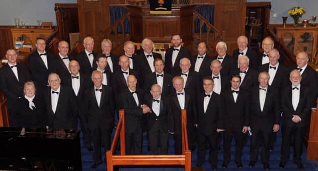Dromore & District Male Voice Choir pictured at their 60th Anniversary Service of Praise & Thanksgiving in First Dromore Presbyterian Church on Sunday 1st February.  Included are Gertrude Jamieson, Accompanist (left) and David Thompson, Conductor (right).