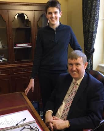 Ballymoney High School Head Boy Timothy Gamble on work experience with Minister Mervyn Storey. INBM07-15 S
