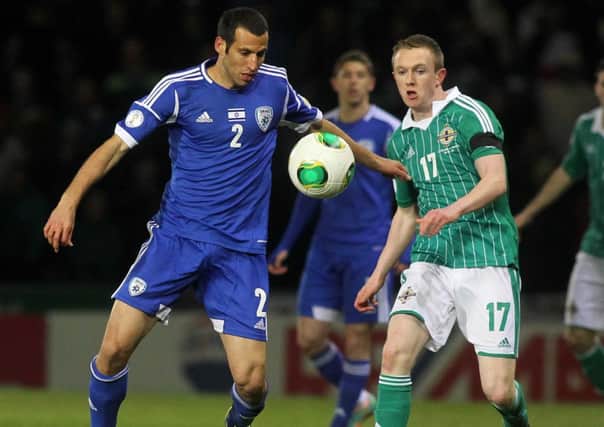 Northern Ireland's Shane Ferguson tussles with Israel's Yuvai Shpungin, during their World Cup Qualifier. Picture by Jonathan Porter/Presseye