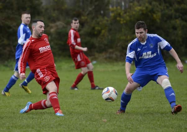 Richard Kayne sets up an attacking move for Tullyally Colts during Saturday's match against Burnfoot. INLS0615-115KM