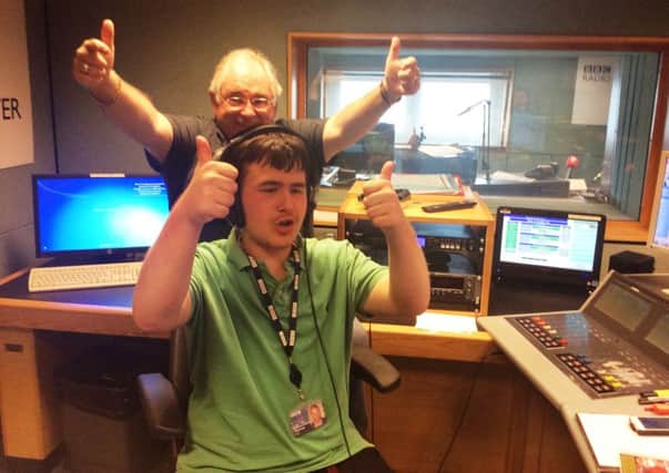 Conor, a user of Cedars Youth Matters service, enjoys a day at BBC Radio Ulster with presenter Hugo Duncan. INNT-07-700-con