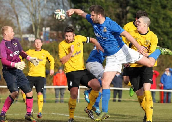 Glenavon's Simon Kelly  tries to win the ball during the cup clash at  Tillysburn Park.