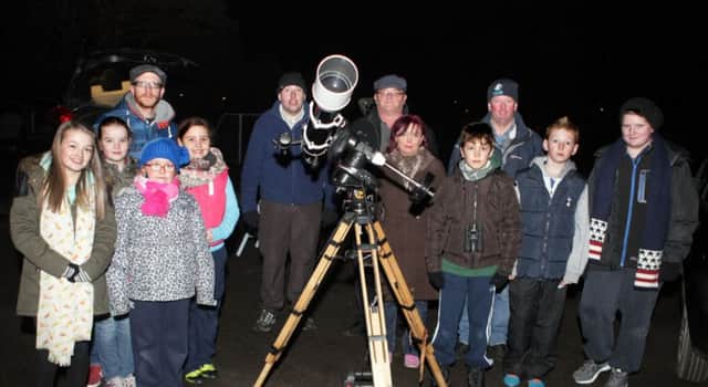 STARS IN THEIR EYES. Leaney PS Teacher, Gary Magee,  (left) pictured with P7 pupils along with Stevie, Jason, Geraldine and Jonathan from the N.Ireland Amateur Astronomical Society (NIAAS) on Tuesday night.INBM6-15 007SC.