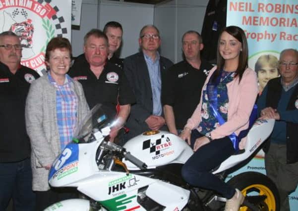 Members of the Mid Antrim motorcycle club with Miss Mid Antrim, Zoe McKinnon, after the club was relaunched at the Kings Hall. Picture: Roy Adams.