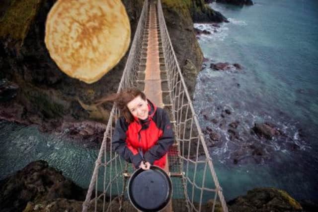 Gillian Adams, National Trust Site Manager - extreme pancake tossing on Carrick-a-Rede rope bridge. inbm07-15