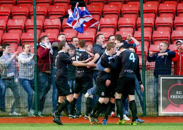 Ballymena United supporters celebrate David Cushley's winning goal in Saturday's Irish Cup tie at Solitude. Picture: Press Eye.